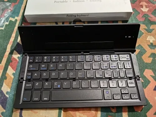 Ultra-Thin Folding Bluetooth Keyboard with Phone Holder Support photo review