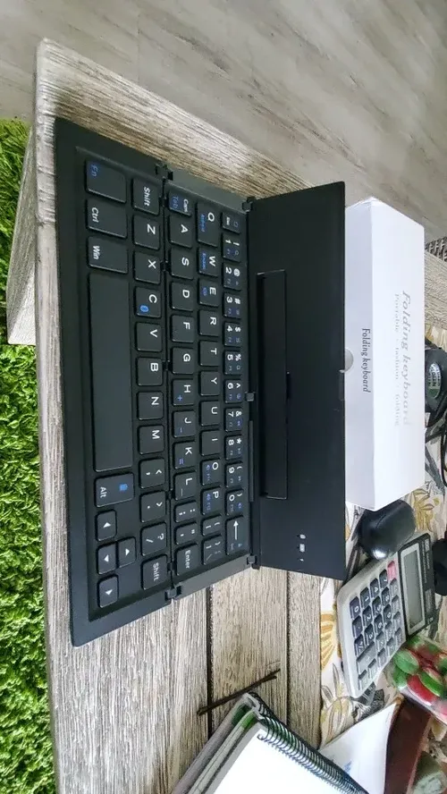 Ultra-Thin Folding Bluetooth Keyboard with Phone Holder Support photo review