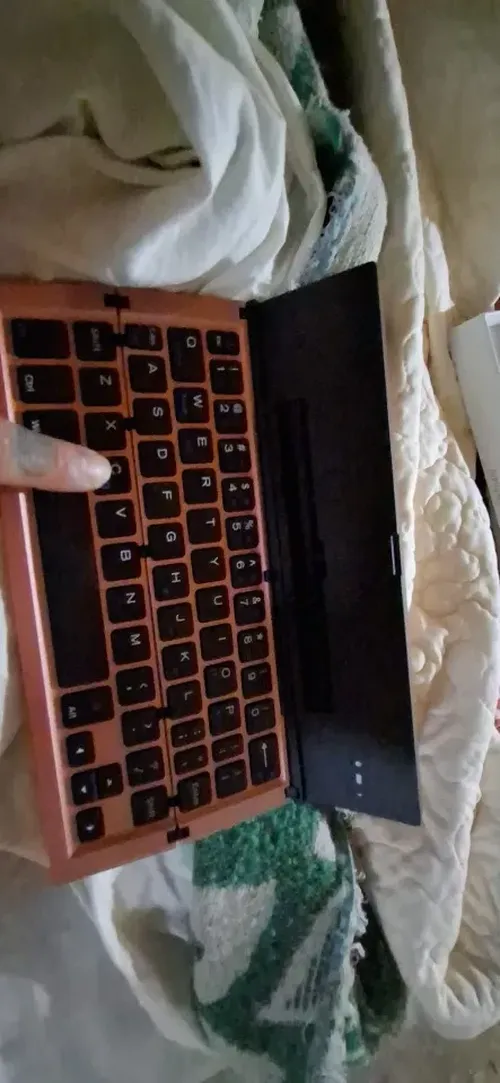 Ultra-Thin Folding Bluetooth Keyboard with Phone Holder Support photo review